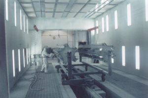 workers using liquid spray system